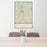 24x36 Woodstock Vermont Map Print Portrait Orientation in Woodblock Style Behind 2 Chairs Table and Potted Plant