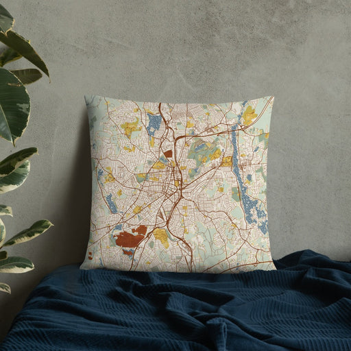 Custom Worcester Massachusetts Map Throw Pillow in Woodblock on Bedding Against Wall