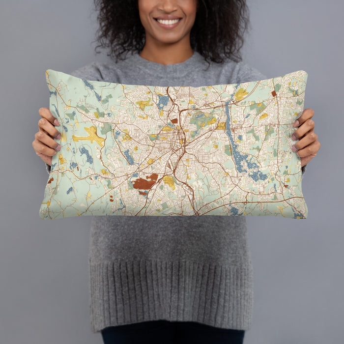 Person holding 20x12 Custom Worcester Massachusetts Map Throw Pillow in Woodblock