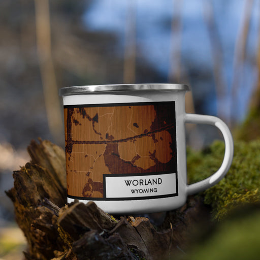 Right View Custom Worland Wyoming Map Enamel Mug in Ember on Grass With Trees in Background