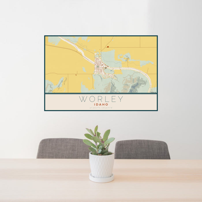 24x36 Worley Idaho Map Print Lanscape Orientation in Woodblock Style Behind 2 Chairs Table and Potted Plant