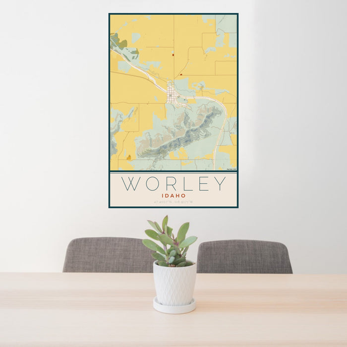 24x36 Worley Idaho Map Print Portrait Orientation in Woodblock Style Behind 2 Chairs Table and Potted Plant