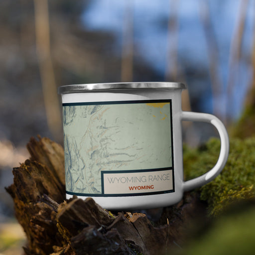 Right View Custom Wyoming Range Wyoming Map Enamel Mug in Woodblock on Grass With Trees in Background