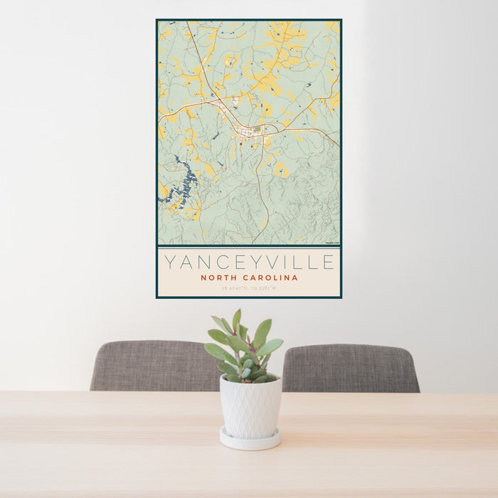 24x36 Yanceyville North Carolina Map Print Portrait Orientation in Woodblock Style Behind 2 Chairs Table and Potted Plant