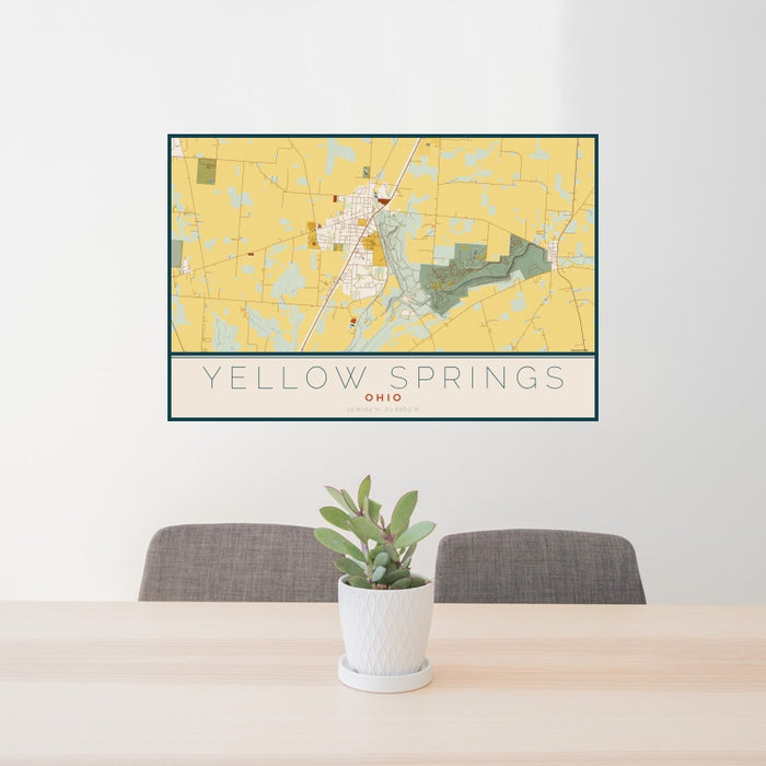 24x36 Yellow Springs Ohio Map Print Landscape Orientation in Woodblock Style Behind 2 Chairs Table and Potted Plant