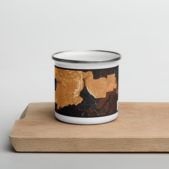Front View Custom Yellowstone National Park Map Enamel Mug in Ember on Cutting Board