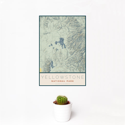 12x18 Yellowstone National Park Map Print Portrait Orientation in Woodblock Style With Small Cactus Plant in White Planter