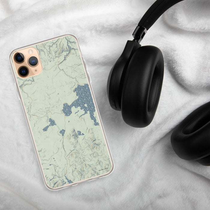 Custom Yellowstone National Park Map Phone Case in Woodblock on Table with Black Headphones