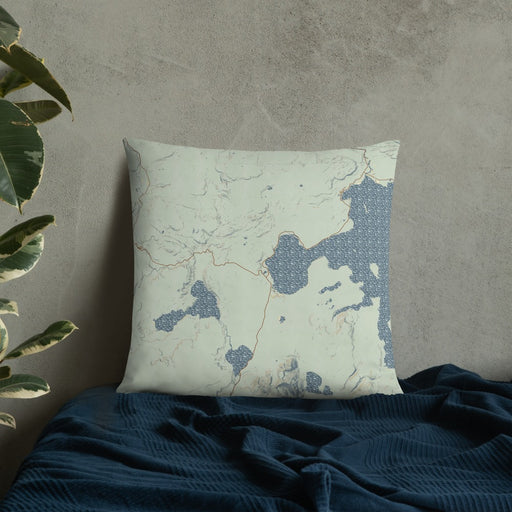 Custom Yellowstone National Park Map Throw Pillow in Woodblock on Bedding Against Wall