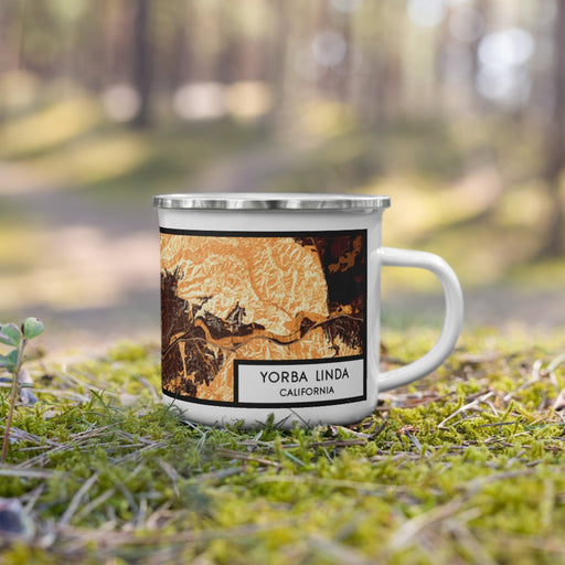 Right View Custom Yorba Linda California Map Enamel Mug in Ember on Grass With Trees in Background
