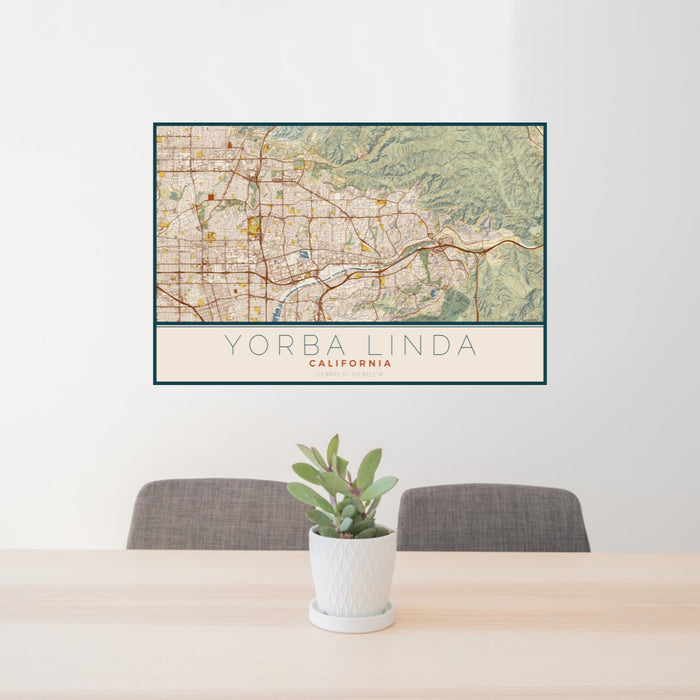 24x36 Yorba Linda California Map Print Landscape Orientation in Woodblock Style Behind 2 Chairs Table and Potted Plant