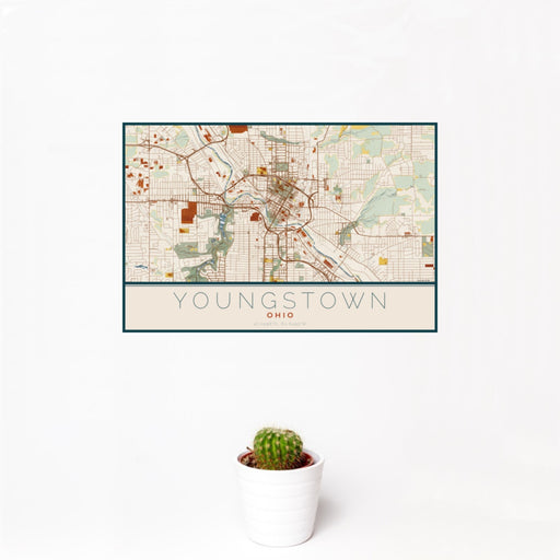 12x18 Youngstown Ohio Map Print Landscape Orientation in Woodblock Style With Small Cactus Plant in White Planter