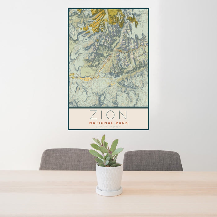 24x36 Zion National Park Map Print Portrait Orientation in Woodblock Style Behind 2 Chairs Table and Potted Plant